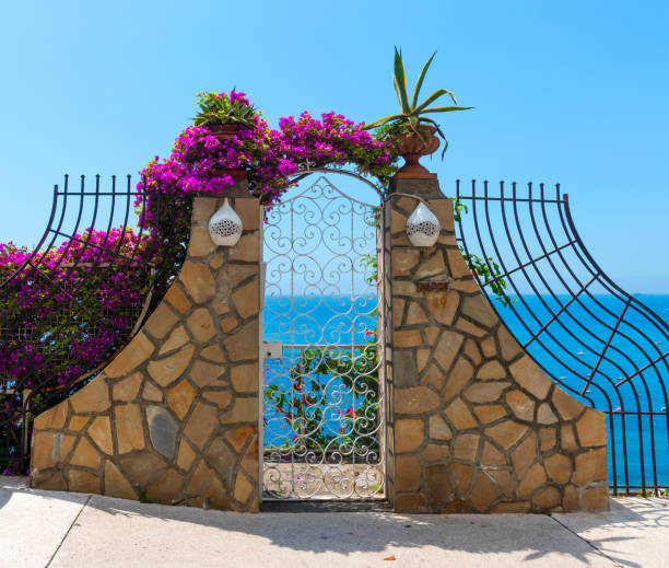 istock Small gates by the cliff on a clear day in Positano 1175722629