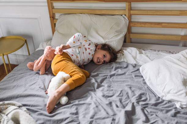 istock Little Girl Lying on bed 1175724091
