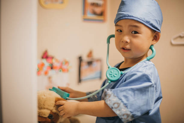 piccolo medico, veterinario - child playing dressing up imagination foto e immagini stock