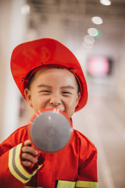istock Young boy in fireman costume 1175729117
