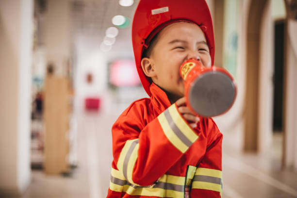 istock Young boy in fireman costume 1175729150