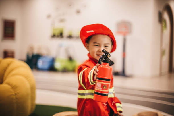 istock Young boy in fireman costume 1175729158