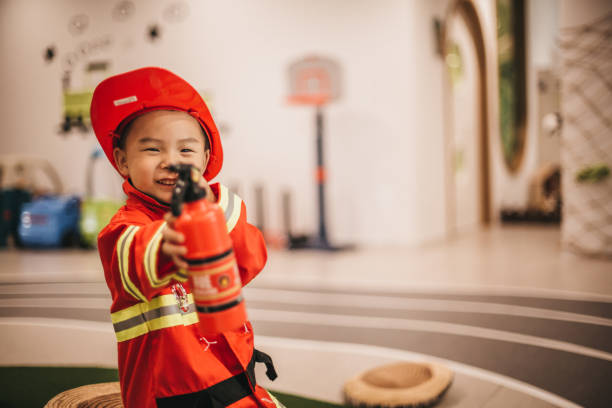 istock Young boy in fireman costume 1175729159