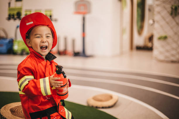 Young boy in fireman costume