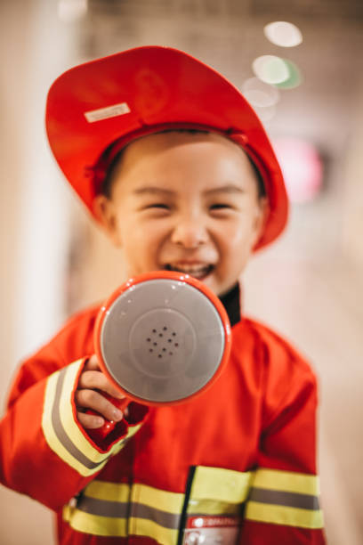 istock Young boy in fireman costume 1175729405