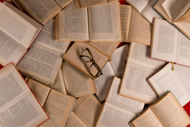 istock Reading Glasses On Top Of Books 1175730502