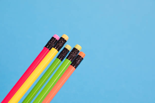 istock Five multicolored crayons are closely and diagonally arranged on a pale-blue background flatlay isolated 1175731477