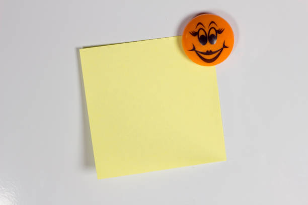 Yellow empty sticker on the fridge with a cheerful smile
