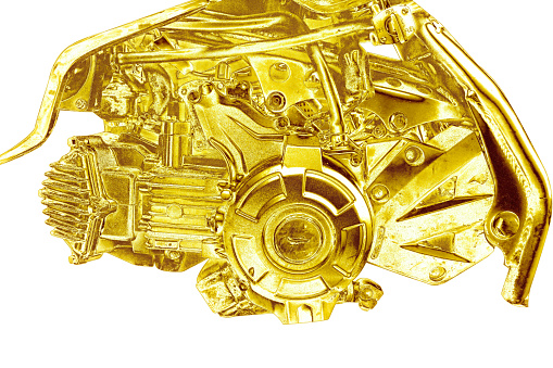 Motorcycle engine shiny gold sparkling white background