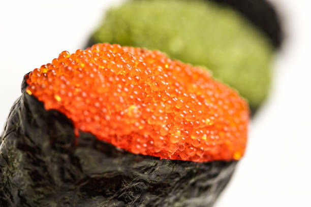 istock Fresh gunkan maki sushi rolls with multicolored caviar. Isolated on a white background 1175732163