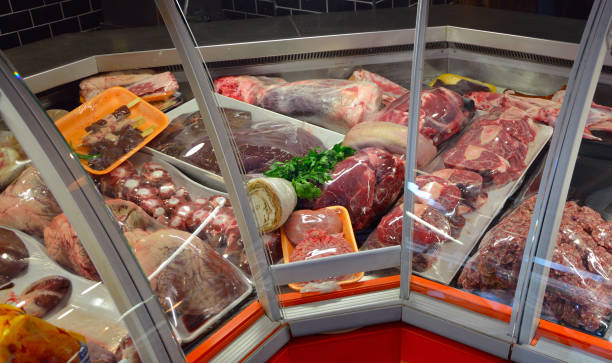 istock Showcase with raw meat in butcher shop. 1175732421