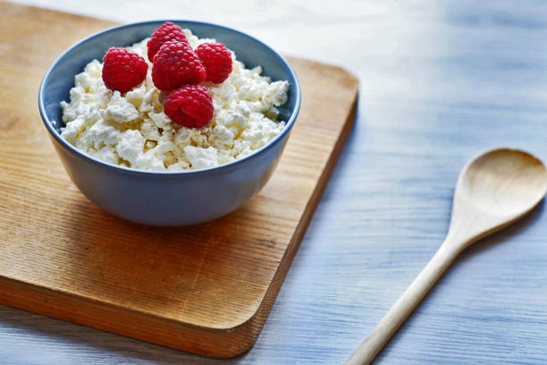 istock Cottage cheese with fresh raspberries in a bowl, healthy breakfast 1175733762