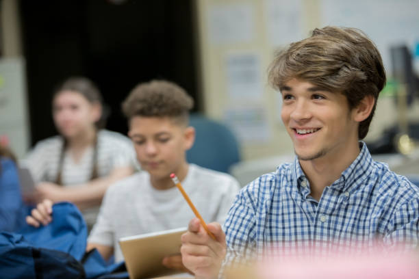 istock Male high school student answering a question 1175734067