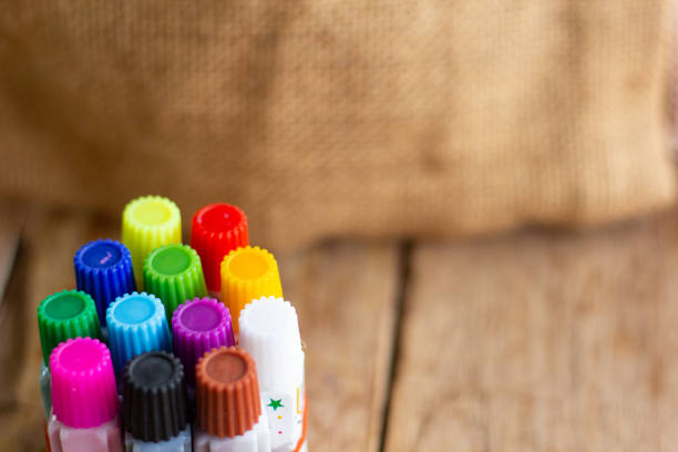 istock Watercolor equipment, with 12 colors, brown background 1175741489