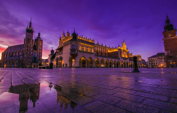 istock Romantic view of Krakow at sunrise with reflection in the puddle 1175743073