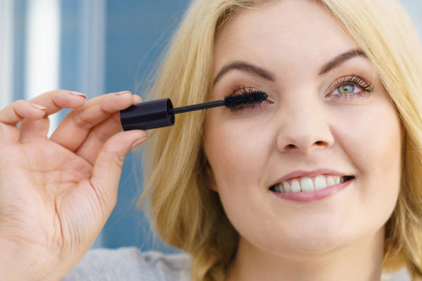 istock Woman using mascara on her eyelashes 1175748454