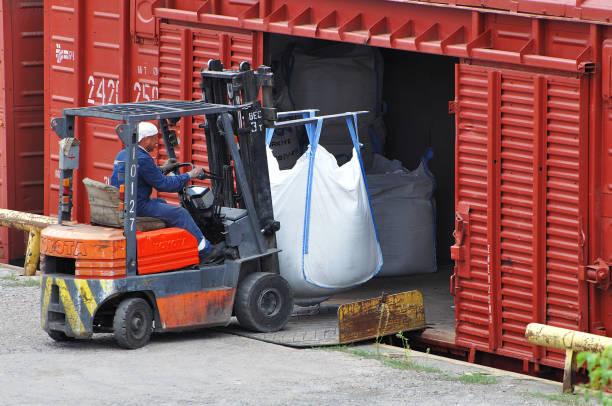 Animated visualization of data processing in a warehouse, showing logistics workers handling and organizing large boxes amidst digital inventory graphics.