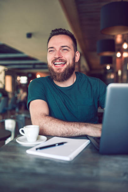 istock Happy Male Freelancer In Coffee Bar 1175748545