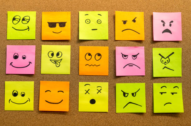 istock cork board with various faces on post it concept photo 1175748673