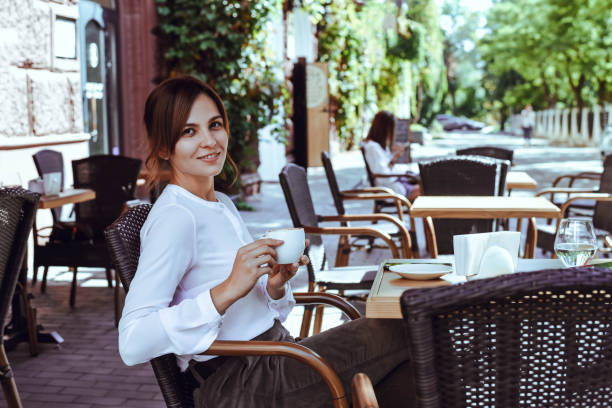 istock Beautiful girl sits in a cafe and drinks coffee. 1175750992
