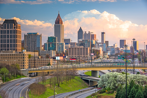 Atlanta, Georgia, USA downtown city skyline over highways at dusk.