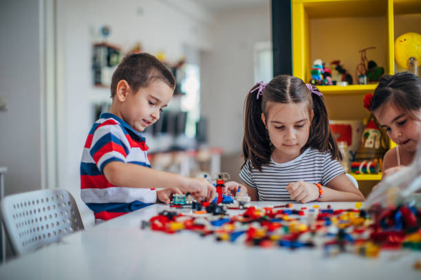 istock Kids playing with toy cubes 1175752532