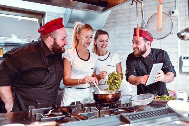 istock Chef Showing New Recipe To Colleagues On A Digital Tablet 1175755372