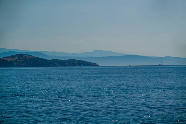 Crystal clear sea and the picturesque pebbled beach in Skiathos, Greece