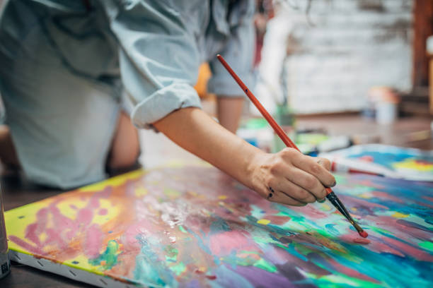 istock Creative woman painting in her studio 1175756018