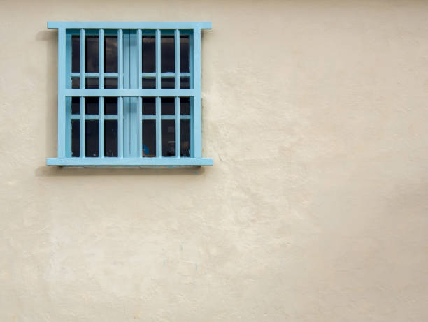 istock View of an old wooden window at sunset 1175762721