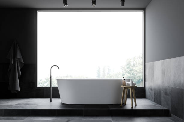 istock Gray and tiled panoramic bathroom with tub 1175763020