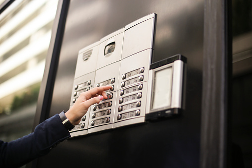 Intercom Use Using An Intercom Stock Photo - Download Image Now - Intercom, Doorbell ...