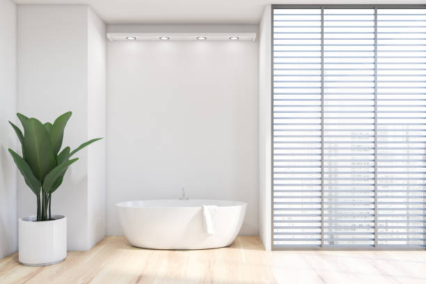 istock White bathroom with blinds and tub 1175763883