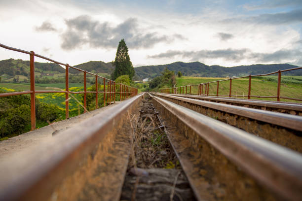 Perspective view of train tracks that goes over the Teatinos river, in the highlands of the Andean mountains of central Colombia.