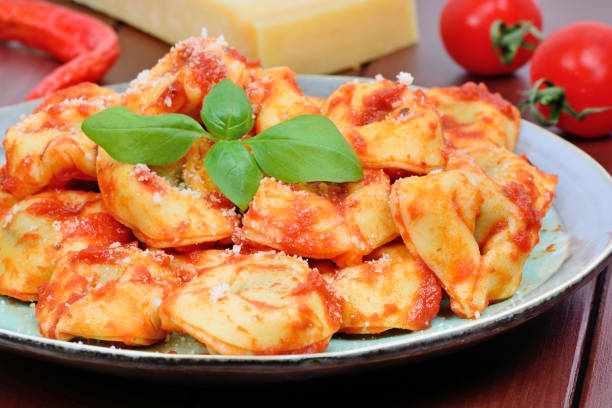 istock Tortellini with tomatoes sauce in a plate 1175768337