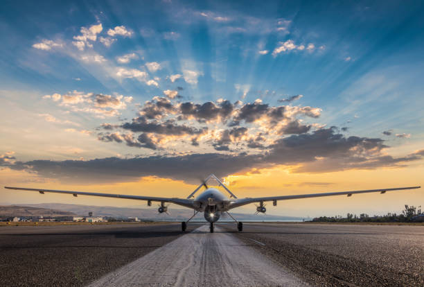 armed unmanned aerial vehicle on runway - military reconnaissance airplane imagens e fotografias de stock