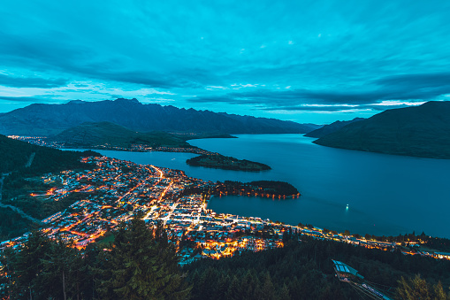 Mountain Cityscape in Queenstown in the south island of New Zealand. The beautiful lake Wakatipu seen at this fantastic travel destination.