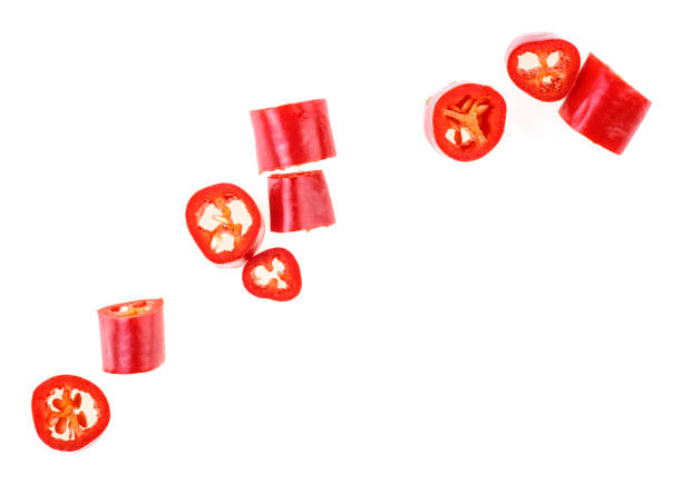istock Red chopped chili peppers on white background, top view. 1175773337