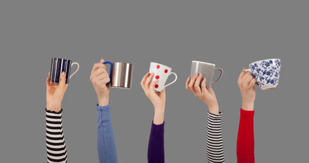istock arms raised people holding coffee cup 1175774482