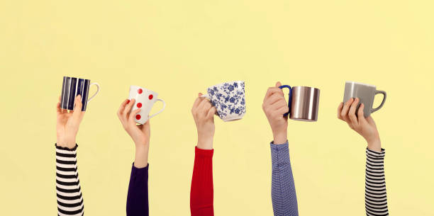 arms raised people holding coffee cup