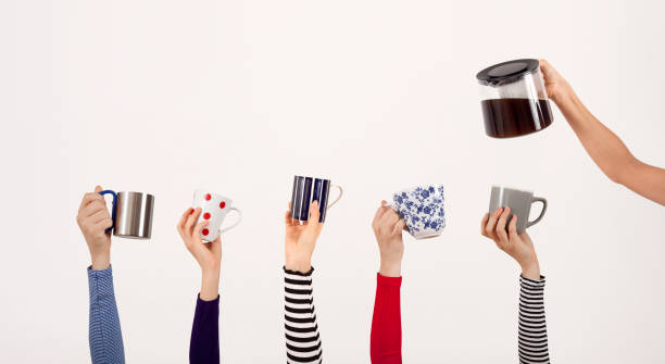 istock arms raised people holding coffee cup 1175774493