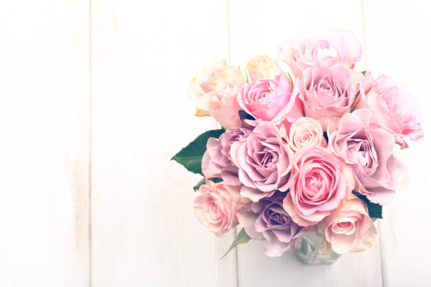 istock bouquet of pink roses isolated on light background 1175775398