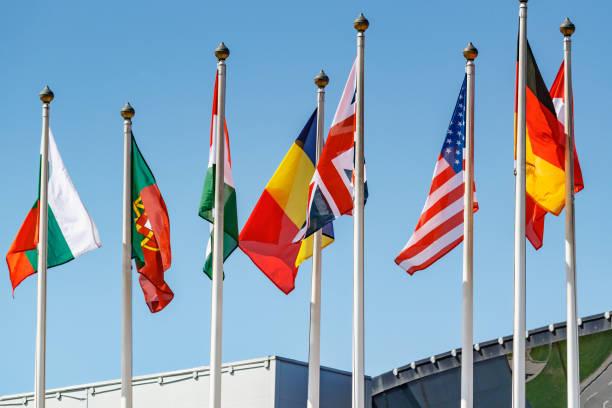 istock Flags of different countries in sunlight against blue sky 1175780663