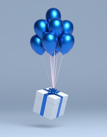 christmas gift with balloons on coloured background
