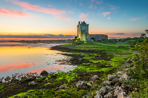 Dunguaire Castle on the shores of Galway Bay Ireland during a beautiful sunset