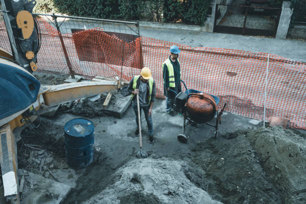 istock Construction Workers in Preparation of Cement at the Building Site 1175794223