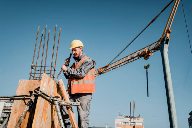 istock Building Worker is Working at the Rooftop at the Construction Site 1175794297