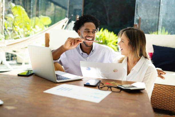 istock Young couple using technology together in the living room 1175798442