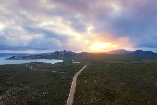 Aerial view of the road runs through vast meadows in Lucky Bay in Cape Le Grand National Park near Esperance at Western Australia, Australia. Australian tourism, landscape, or nature travel concept Aerial view of the road runs through vast meadows in Lucky Bay in Cape Le Grand National Park near Esperance at Western Australia, Australia. Australian tourism, landscape, or nature travel concept cape le grand national park stock pictures, royalty-free photos & images