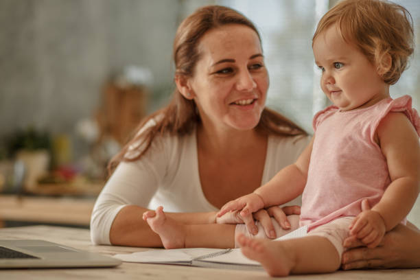 istock Mother and her baby daughter enjoying while cuddling together 1175802565